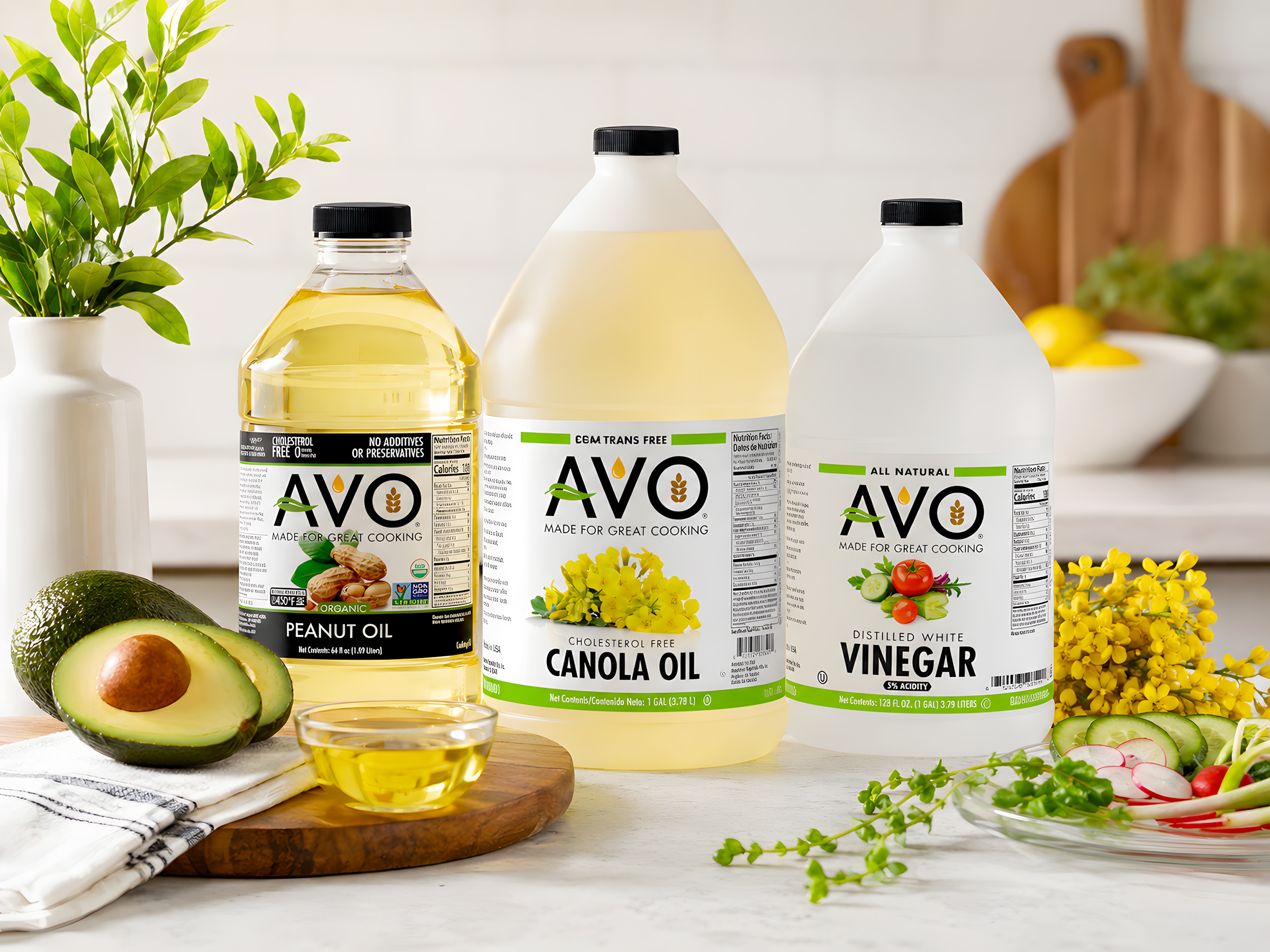AVO cooking oil and vinegar packaging displayed in a kitchen setting